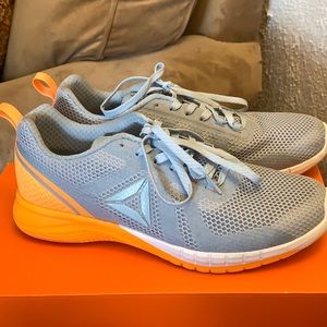 Orange and grey Reebok sneakers